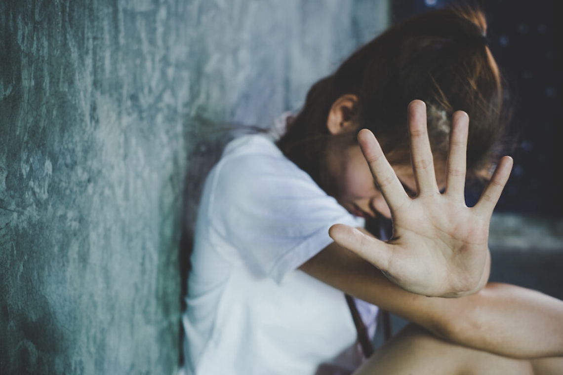 Woman bondage in angle of abandoned building image blur , stop violence against Women, international women's day