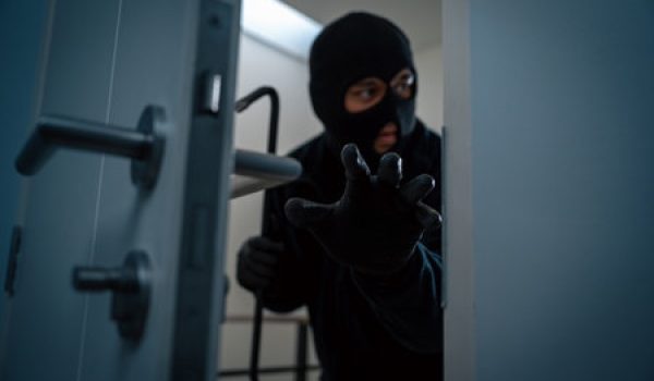 thief in uniform black jacket various action housebreak the robber terrorism criminal escapes with