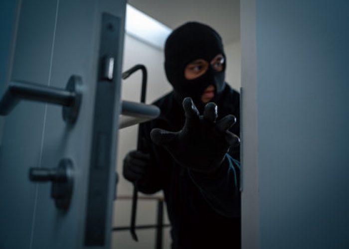thief in uniform black jacket various action housebreak the robber terrorism criminal escapes with