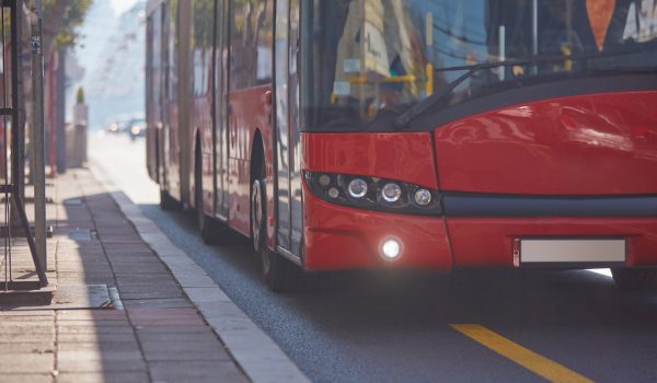 Public transportation / bus in urban surroundings on a station.