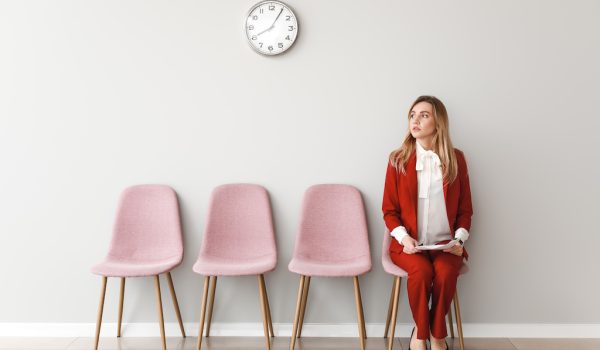 Young woman waiting for job interview indoors
