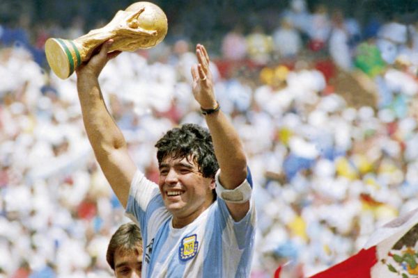 MEXICO CITY, MEXICO - JUNE 29: Diego Maradona of Argentina holds the World Cup trophy after defeating West Germany 3-2 during the 1986 FIFA World Cup Final match at the Azteca Stadium on June 29, 1986 in Mexico City, Mexico. (Photo by Archivo El Grafico/Getty Images)