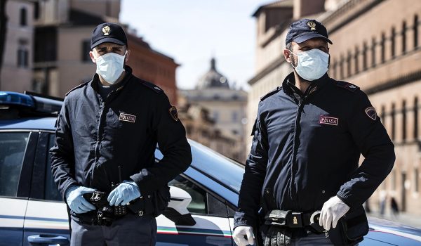Italian police officers wearing protective masks out checks on motorists and pedestrians due to the Coronavirus emergency  in Rome, Italy, 12 March 2020. Tough lockdown measures kicked in throughout Italy on 12 March after Prime Minister Giuseppe Conte announced late on 11 March that all non-essential shops should close as part of the efforts to contain the ongoing pandemic of the COVID-19 disease caused by the SARS-CoV-2 coronavirus. ANSA/ANGELO CARCONI