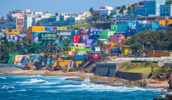 Colorful houses line the hill side overlooking the beach in San Juan, Puerto Rico.